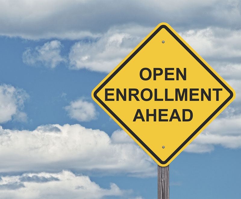 Street sign that says open enrollment ahead