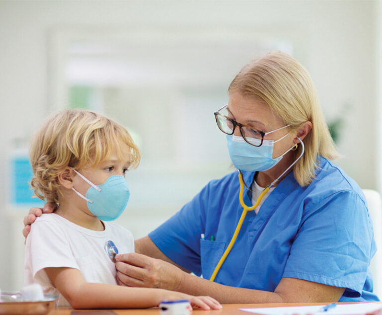 Photo of healthcare worker listening to pediatric patient's chest