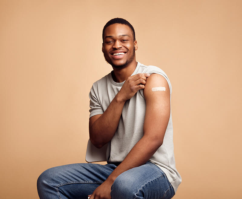 Vaccinated man showing arm