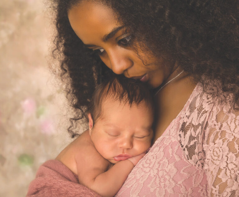 Mother kissing baby's head