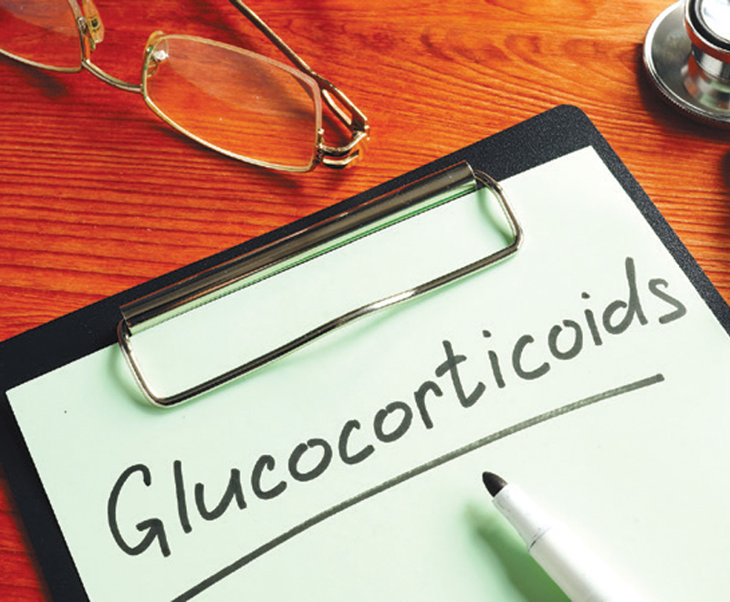 Photo of clipboard holding paper that says "Glucocorticoids"