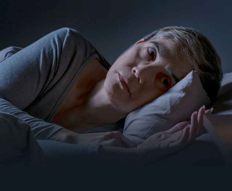 Image of woman laying awake