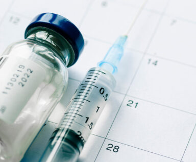 Photo of medicine, syringe and calendar