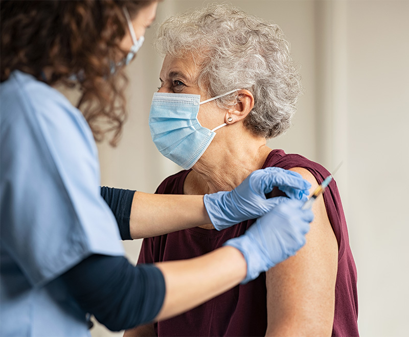 Photo of senior citizen receiving injection