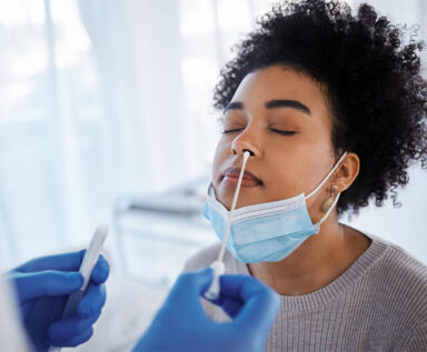 woman receiving nasal swab