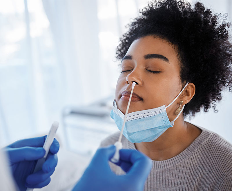 woman receiving nasal swab