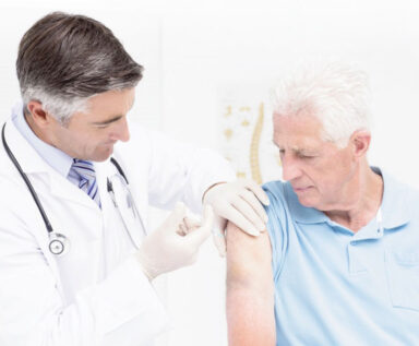 Photo of senior man receiving a vaccine