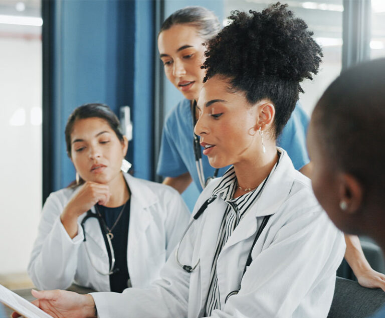 Photo of medical researchers looking at files