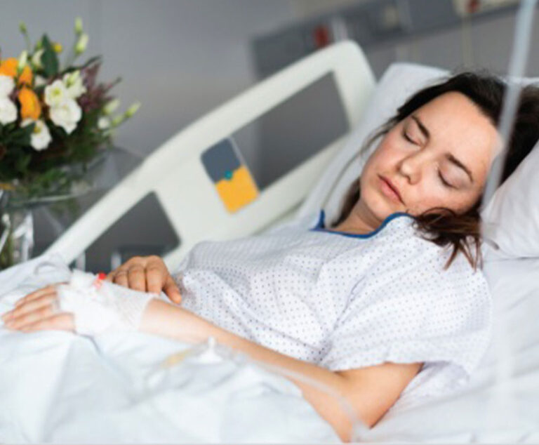 Photo of woman sleeping in a hospital bed